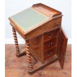 A Victorian burr-walnut Davenport desk by Gillows of Lancaster, with side cupboard enclosing three