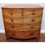 A 19th century bow-front flame-mahogany chest of two short and three long graduated drawers with