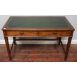 A Gordon Russel 'War Department' stained oak desk, with gilt-tooled inset green leather scribe,