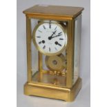 French gilt brass mantel clock, white enamel dial with Roman numerals, with four bevelled glass