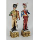 Two Capo-di-Monte porcelain figures of Napoleonic soldiers, signed B. Merli, 30cm