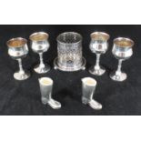 A small collection of assorted silver-plated wares comprising four goblets, a Mappin and Webb bottle