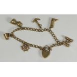 A 9ct gold bracelet with six gold charms including ship's wheel, anchor, binoculars, rum tankard