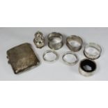 A pair of silver napkin rings together with four various silver napkin rings, a silver cigarette