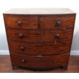 A 19th century bow-front mahogany chest of two short and three long graduated drawers, turned