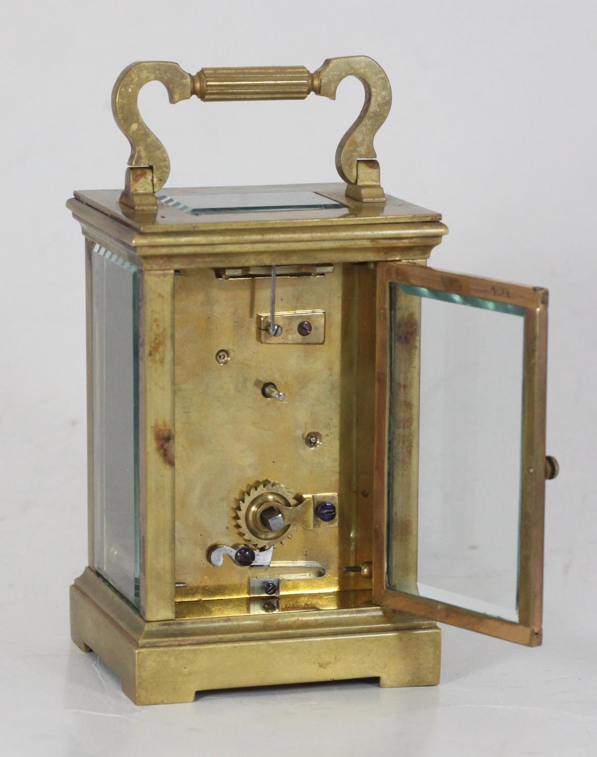 A brass carriage clock, the top with platform escapement, the ivory coloured dial with Arabic - Image 2 of 3