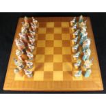 A Tudor inspired chess set with composite figures depicting Henry VIII as king etc. together with