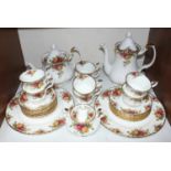 SECTION 15. A Royal Albert 'Old Country Roses' part tea set comprising teapot, coffee pot, two large