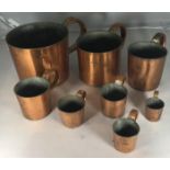 A set of eight Royal Navy rum / grog measures with impressed sizes and ERII mark, some numbered -