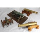 A pair of brass table cannons on oak four-wheel carriages, the cannons 27cm long, together with