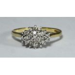 An 18ct gold and diamond cluster ring set with 23 small diamonds, gross weight 3.5g, ring size O