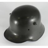 A WWI German M16 duckbill helmet shell with replacement chin strap