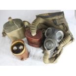 A WWII gas mask and canister in canvas bag, stamped 'WHB 1940' (may contain asbestos), a military