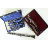 An oboe stamped 'F Buisson, sole distributors Dallas, London' together with a clarinet by Buffet,