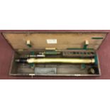 A 4" brass telescope by T. Cooke, York, with numerous interchangeable lenses etc, and adjustable