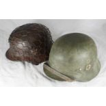 A German double decal M35 style helmet, together with a battlefield find German single decal M40