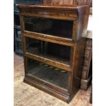 A mahogany three-section glazed Globe Wernicke style bookcase, 124x87cm, together with a Victorian