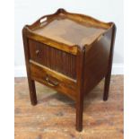 A George III mahogany nightstand, of square form with galleried top, sliding tambour door, stile