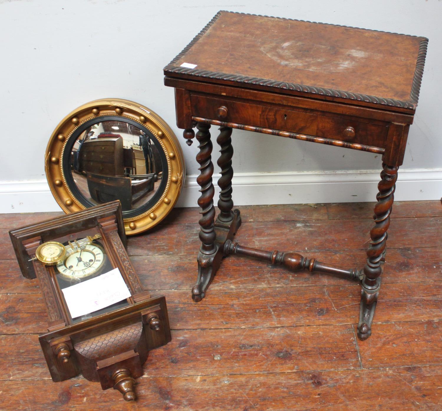 An early 20th century walnut folding card table with shaped rim, single drawer, raised on four