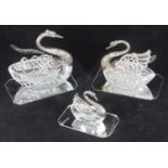 Three graduated silver-mounted glass bon bon dishes modelled as swans, stamped 925 with import