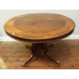 ADDENDUM: NOT A TILT TOP: A Regency mahogany circular tilt-top supper table, raised on turned column