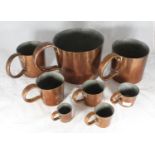 A set of eight Royal Navy rum / grog measures with impressed sizes and ERII mark, some numbered -