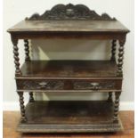 A 19th Century stained oak three-tier buffet table, with barleytwist supports and two acanthus and