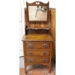 An Edwardian walnut dressing table with later added mahogany tilt-top mirror, three drawers with Art