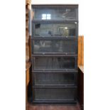 A Meovoto six-section ebonised oak bookcase with up-and-over glazed doors, 86cm wide