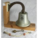 A military silvered wall-hanging bell with applied broad arrow, probably a mess bell, height of bell