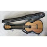 A Tanglewood TU4 Union Series mahogany tenor ukulele with clip-on tuner and housed in hard case,