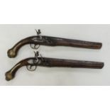 Two various reproduction flintlock pistols with gilt decoration