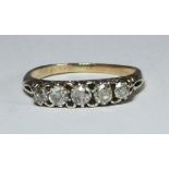 An 18ct gold ring, the top set with five old cut diamonds, estimated total diamond weight