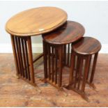 A stained rosewood nest of three oval tables, together with a 19th century stained walnut