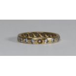 An 18ct gold and diamond eternity ring set with 17 x 0.05 diamonds, total diamond weight