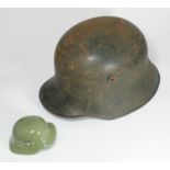 A German M16 Third Reich style helmet, brown leather liner stamped 'Jager Reg, SS, KB, SS-Pol Panzer