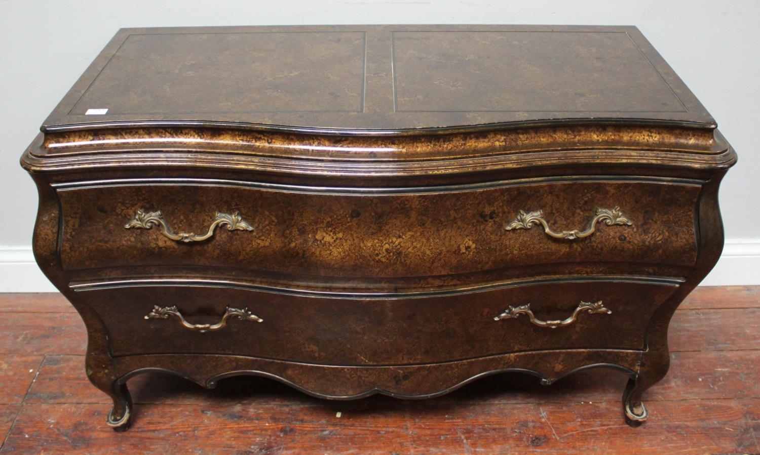 A modern two-drawer commode in the French 18th century style, with lacquered faux burr-wood