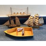 A wooden model of sailing ship Gorch Fock, together with a model of the Titanic, a model of a