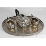 A Garrard & Co silver-plated tea set comprising teapot, sugar bowl and jug, together with a