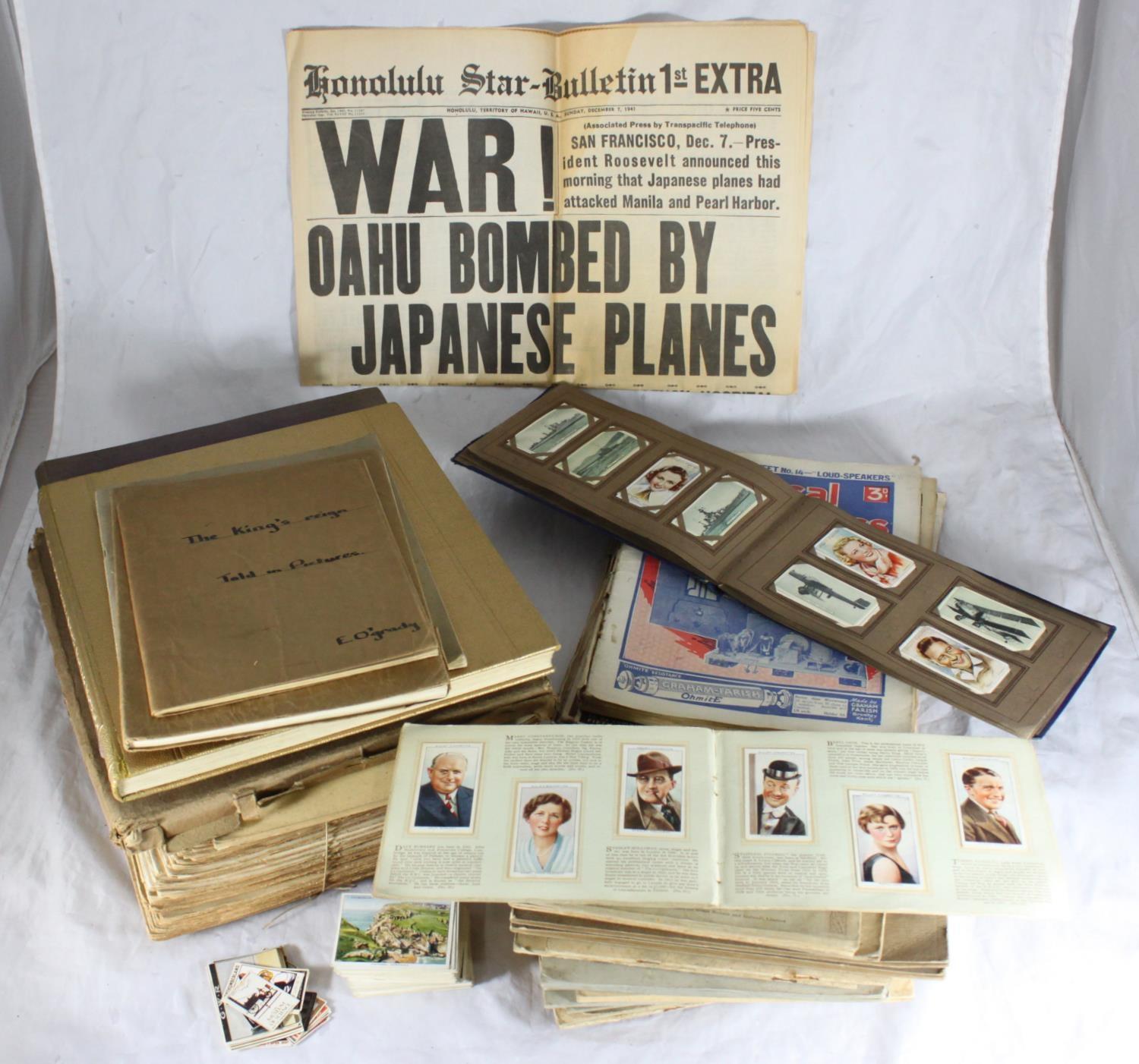 Eighteen books of cigarette cards together with approx. 47 copies of war illustrated, a limited