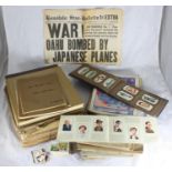 Eighteen books of cigarette cards together with approx. 47 copies of war illustrated, a limited