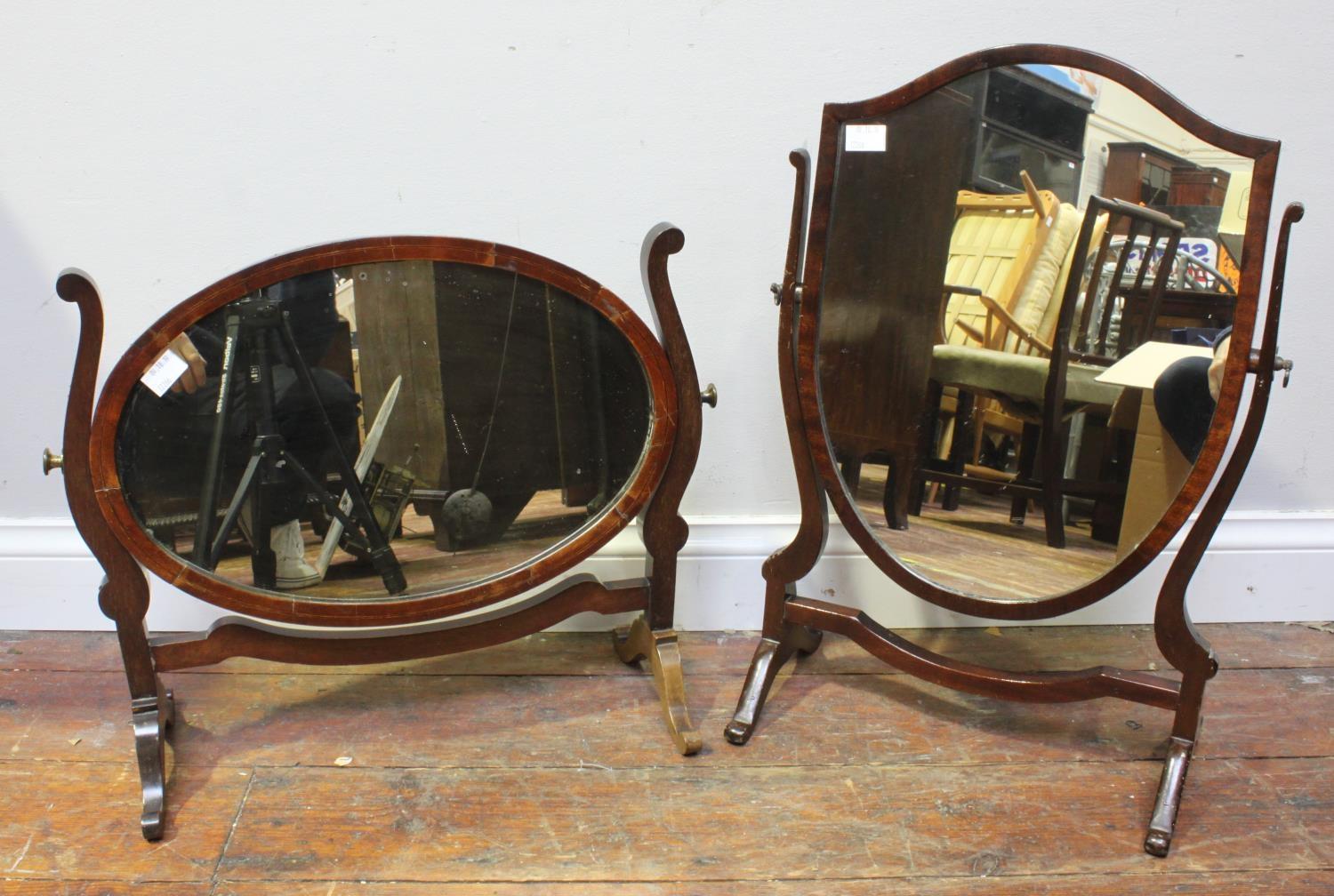 A George III mahogany corner washstand together with two stained-wood toilette mirrors (3)