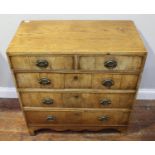 A George III faded mahogany small chest of 2 short and three long drawers, on shaped bracket feet,