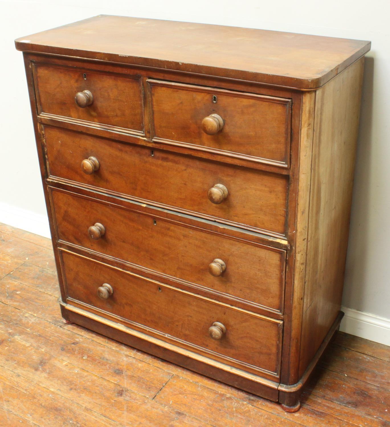 A 19th century stained walnut chest of two short and three long graduated drawers, with original