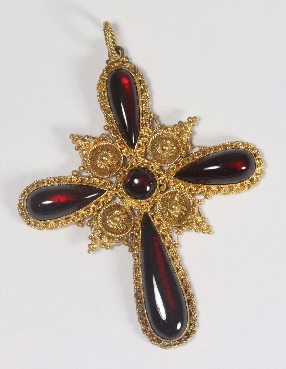 An ornate 15ct gold cross set with cabochon garnets, circa 1870, (af) gross weight 13.6g