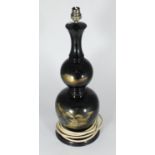 A Japanese double-gourd black lacquered metal table lamp, engraved and gilded with pagodas and Mount