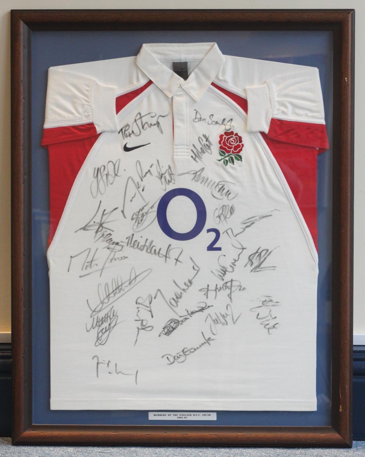 A framed 2002-2003 England rugby shirt signed by 25 members of the squad including Danny Grewcock,