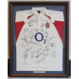 A framed 2002-2003 England rugby shirt signed by 25 members of the squad including Danny Grewcock,