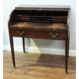 A 19th century stained mahogany roll-top desk, enclosed drawers, pigeonholes and sliding writing