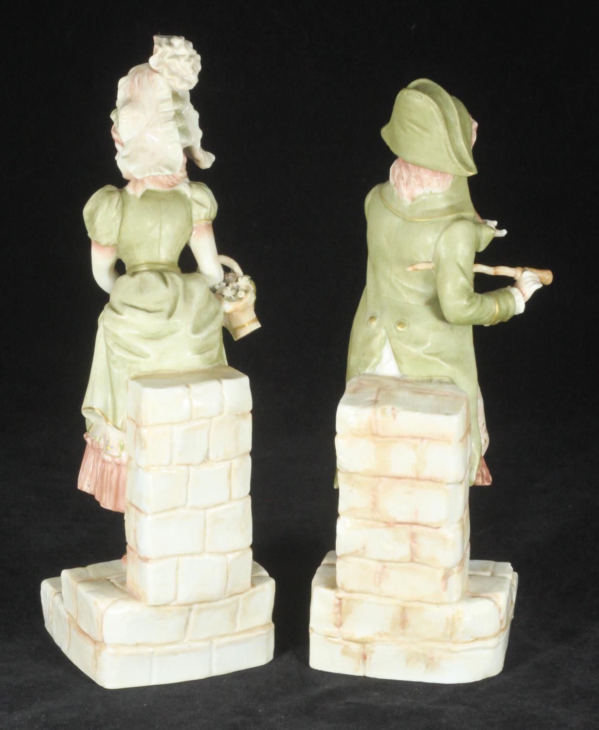 A pair of Ernst Bohne and Sohne porcelain figures of a finely dressed gentleman, and a lady - Image 2 of 2